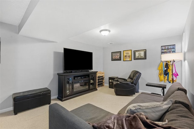 living room featuring carpet floors and baseboards