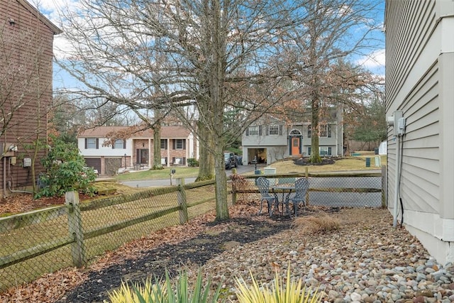 view of yard with fence and a residential view