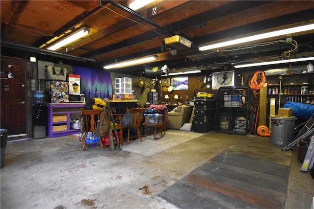 garage featuring a workshop area and a garage door opener