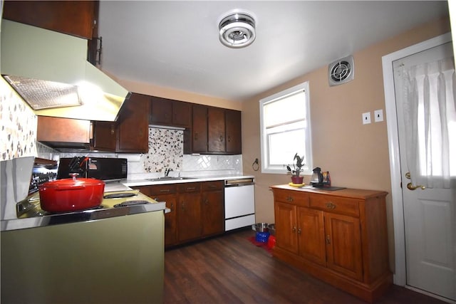 kitchen with white dishwasher, dark wood-type flooring, a sink, ventilation hood, and decorative backsplash