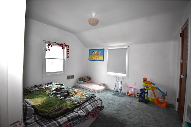 bedroom featuring carpet floors and vaulted ceiling