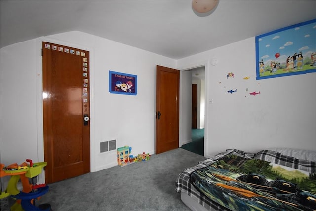 bedroom featuring carpet, visible vents, and vaulted ceiling