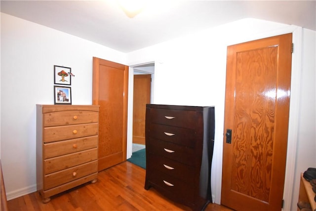 bedroom featuring wood finished floors