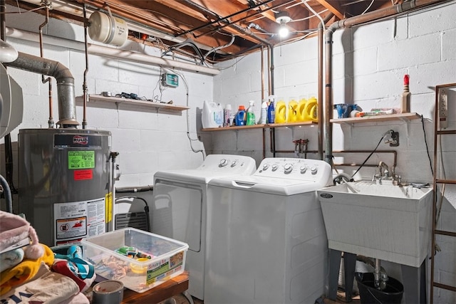 laundry room featuring laundry area, gas water heater, a sink, and washer and dryer