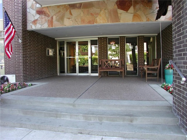 property entrance with brick siding