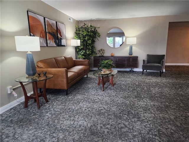 living room with carpet flooring, visible vents, and baseboards