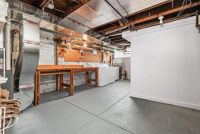 basement featuring washer and dryer and a workshop area