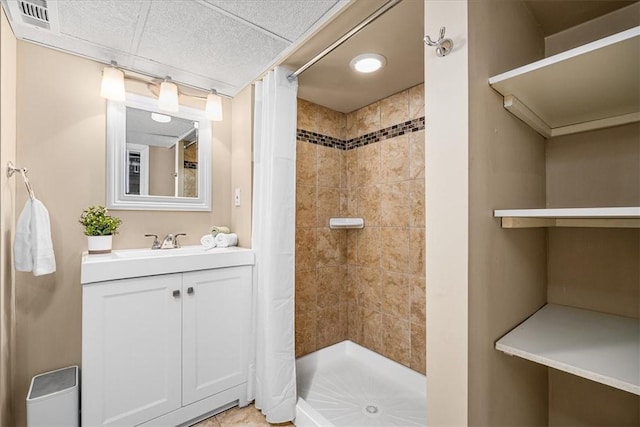 full bath with visible vents, a stall shower, and vanity