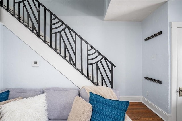 interior space with baseboards and wood finished floors