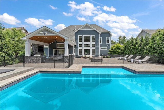 view of pool featuring a patio area, fence, a ceiling fan, and a fenced in pool