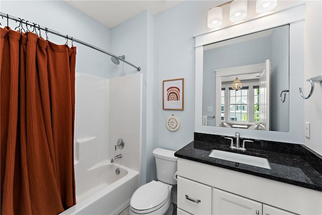 bathroom featuring vanity, toilet, and shower / bath combo with shower curtain