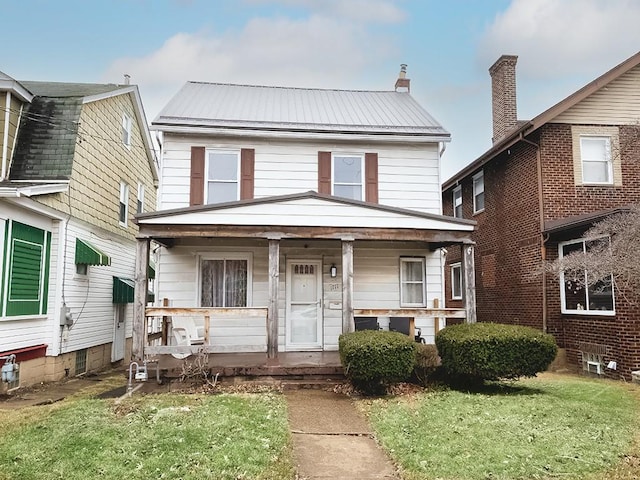 traditional style home with metal roof and a porch