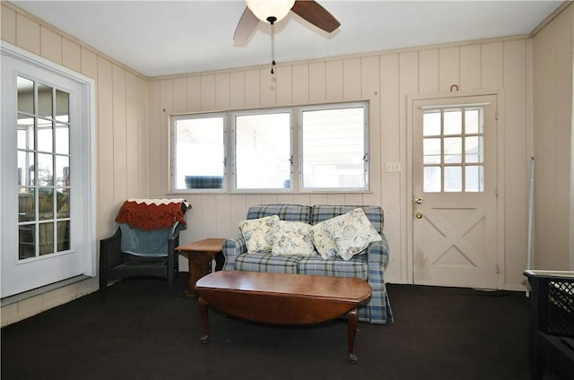 living area featuring ceiling fan