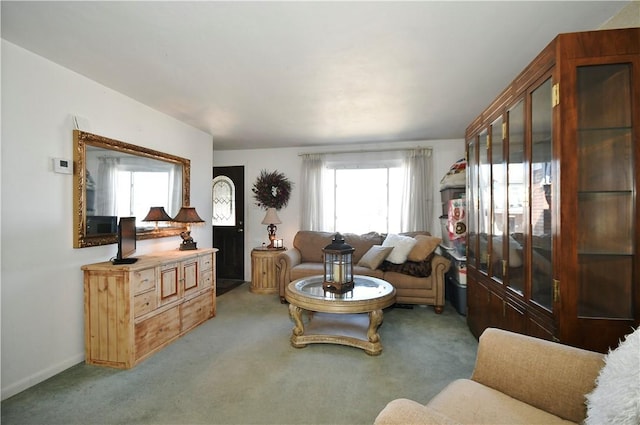 living room with light carpet and baseboards