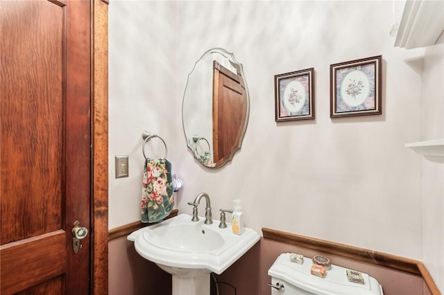 bathroom with a sink and toilet