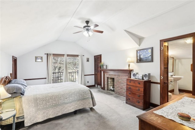 bedroom featuring ceiling fan, carpet floors, baseboards, vaulted ceiling, and a brick fireplace