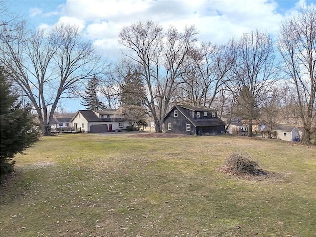 view of yard featuring a garage