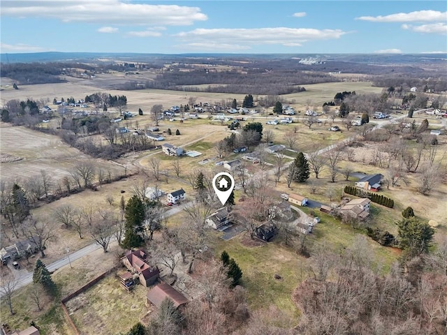 birds eye view of property with a rural view