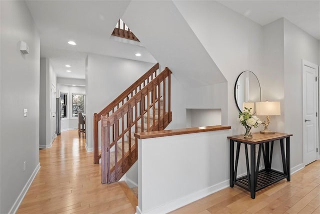 interior space with hardwood / wood-style floors, recessed lighting, and baseboards