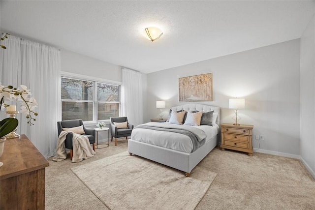 bedroom featuring carpet flooring and baseboards