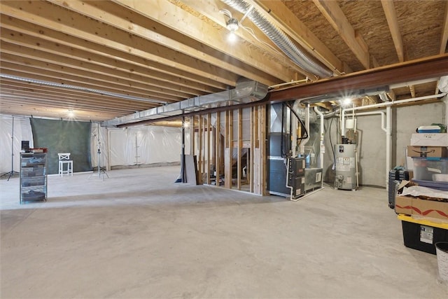 unfinished below grade area featuring water heater and heating unit