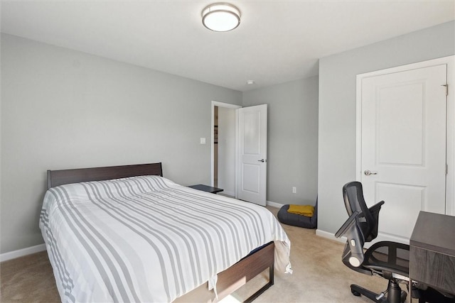 bedroom featuring baseboards and carpet flooring