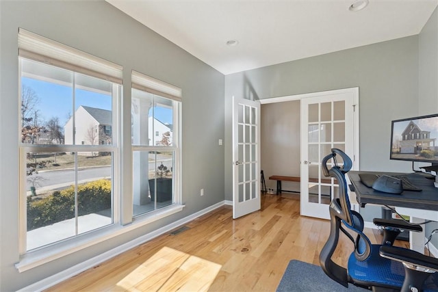 office area with visible vents, baseboards, french doors, light wood-type flooring, and recessed lighting