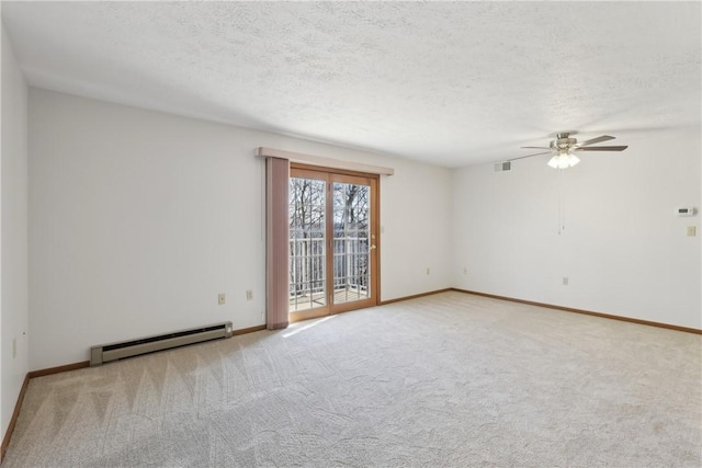 unfurnished room featuring carpet floors, visible vents, baseboard heating, and a textured ceiling