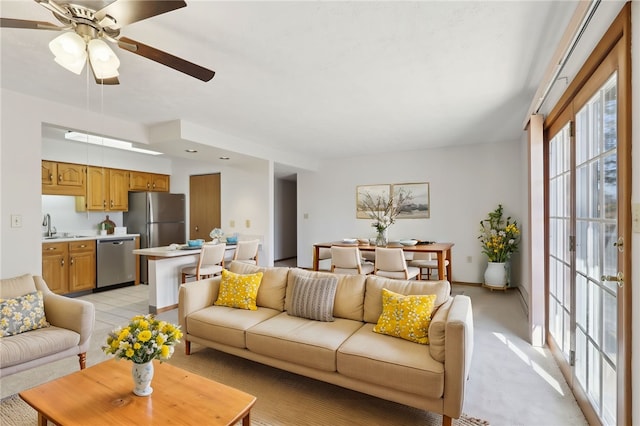 living area with ceiling fan