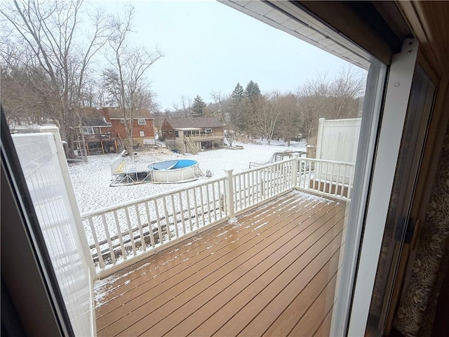 view of snow covered deck