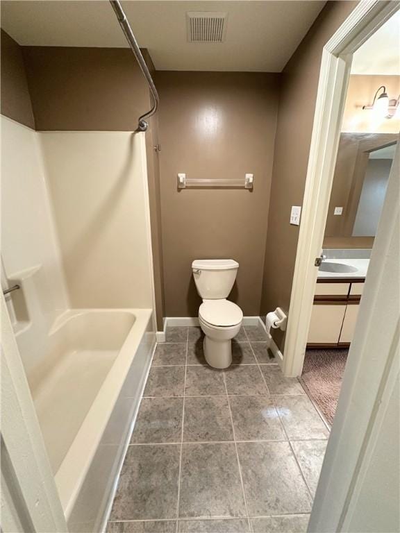 bathroom with toilet, vanity, visible vents, baseboards, and shower / bathing tub combination