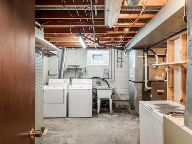 basement with washer and clothes dryer