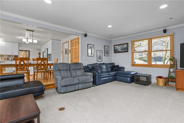 living room with recessed lighting, ornamental molding, and carpet flooring