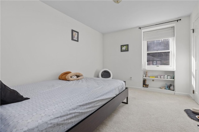 carpeted bedroom with baseboards