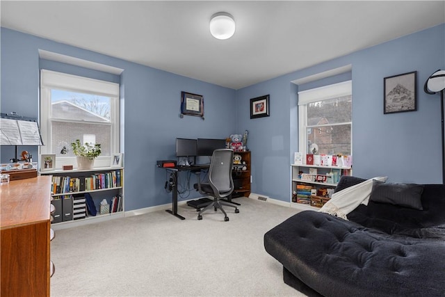 office with baseboards and carpet