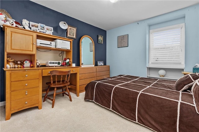 bedroom featuring light carpet