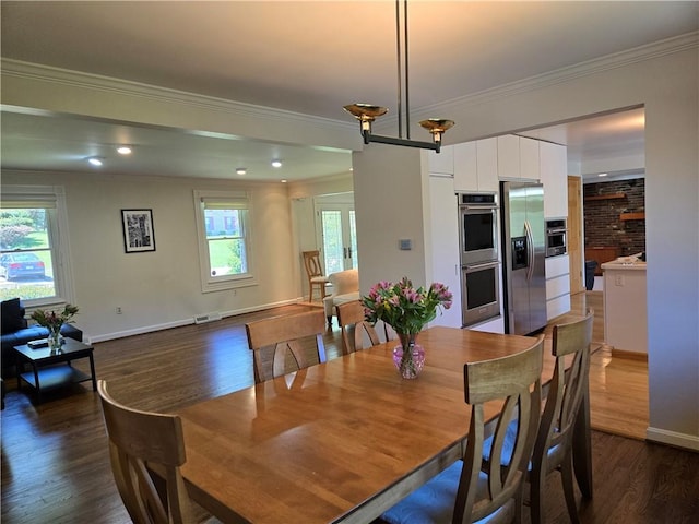 1921 Garrick Dr, Churchill Boro, PA 15235 - dining space with crown molding, dark wood finished floors, and baseboards