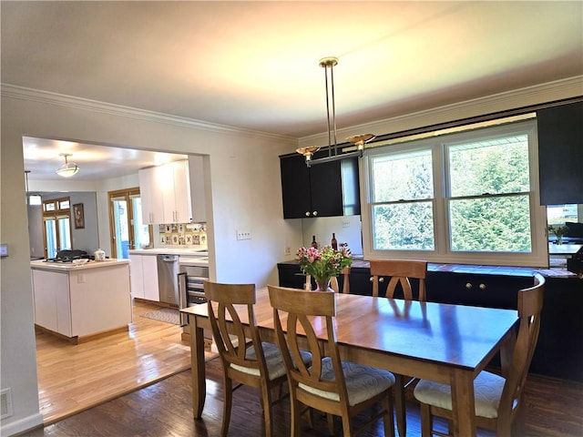 1921 Garrick Dr, Churchill Boro, PA 15235 - dining space featuring healthy amount of natural light, light wood finished floors, crown molding, and a chandelier