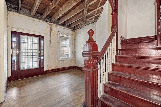 entrance foyer with wood finished floors and stairs