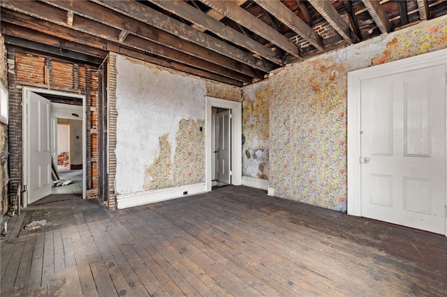 empty room with hardwood / wood-style floors