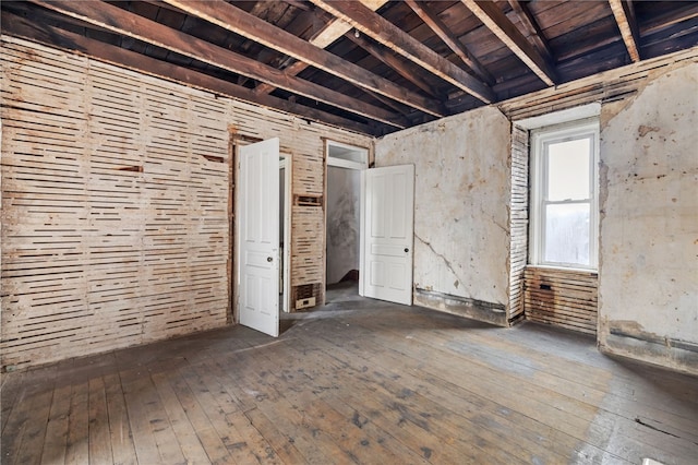 unfurnished bedroom featuring dark wood-style flooring