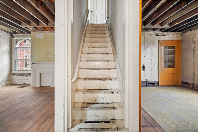 stairway with wood finished floors