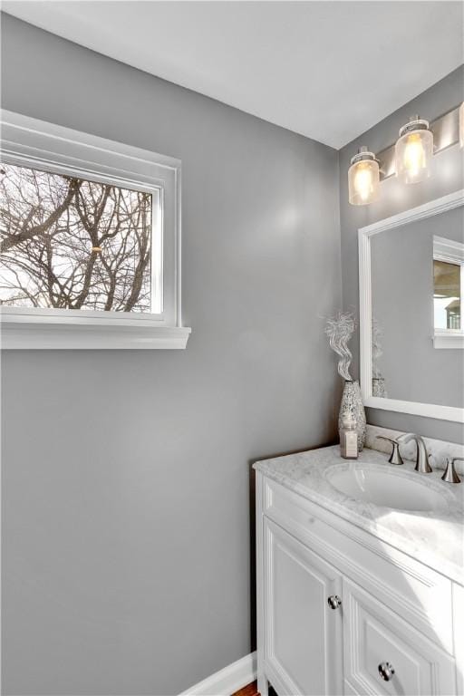 bathroom featuring vanity and baseboards