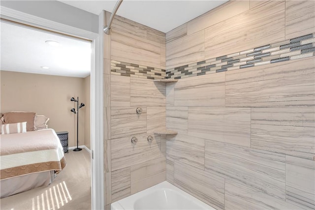 bathroom with bathing tub / shower combination and baseboards