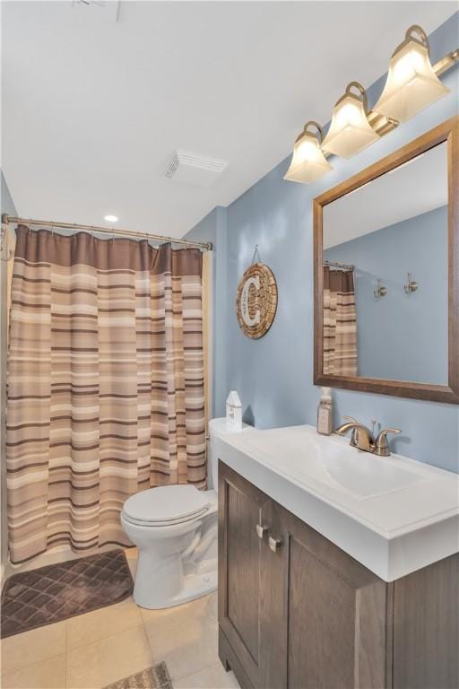 full bathroom featuring curtained shower, visible vents, toilet, vanity, and tile patterned floors