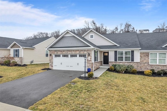 craftsman-style house featuring a garage, stone siding, a front lawn, and aphalt driveway