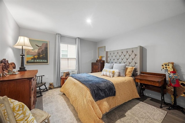 bedroom with wood finished floors