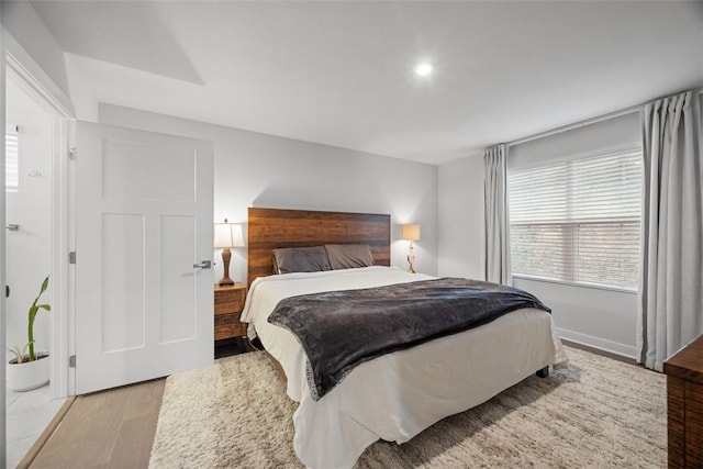 bedroom with wood finished floors