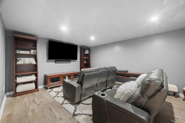 cinema with recessed lighting, baseboards, and wood finished floors