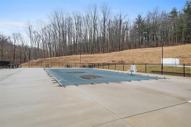 view of pool featuring a patio area, fence, and a fenced in pool